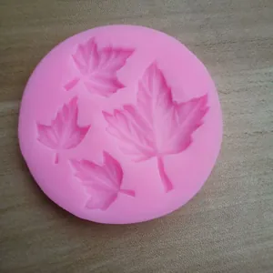 Pink silicone mold with four different sizes of maple leaf cavities for DIY fondant and chocolate.