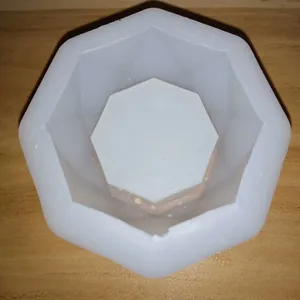 Top view detail of a hexagonal geometric silicone mold for DIY succulent pots and crafts