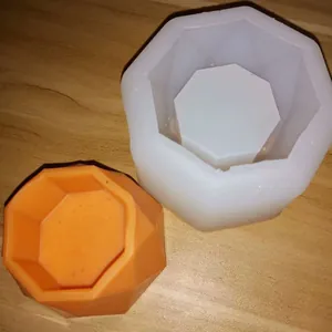 Detailed view of geometric octagon silicone mold with orange finished resin pot.
