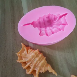 Detailed shot of pink conch shell silicone mold for ocean-themed fondant and resin crafts