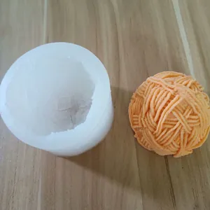 Close-up detail of 3D yarn ball silicone mold and finished textured orange product