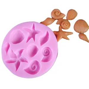 Pink silicone mold with seashell and starfish shapes for DIY chocolate and cake decoration