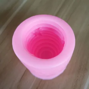 Detailed macro view of the pink tiered interior of a 3D honeycomb silicone mold.