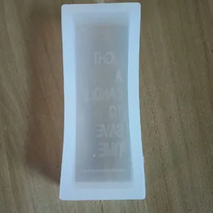 Detailed view of rectangular silicone mold with engraved candle quote text for crafts