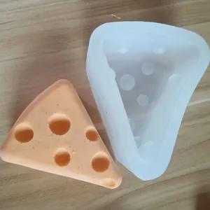 Close-up of triangular cheese-shaped silicone mold for creative DIY cake decorating