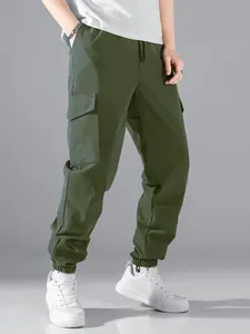 Premium olive green men's cargo joggers with multiple utility pockets and elastic cuffs