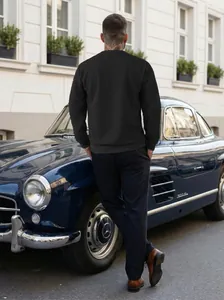 Close-up detail of men's black long sleeve jacquard sweatshirt with textured fabric