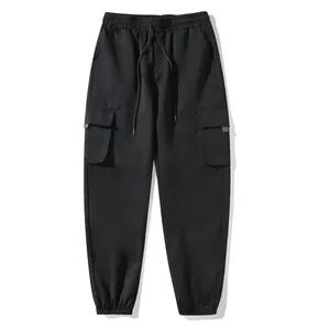 Front view of black cargo joggers with drawstring waist and large side pockets