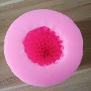 Macro view showing the detailed pine cone texture inside the pink silicone mold