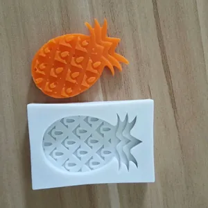 Macro view of pineapple shaped silicone baking mold with finished product detail.
