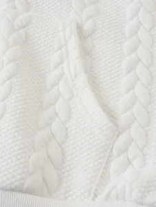 Close-up view of the premium white cable-knit texture on a men's casual thermal hoodie