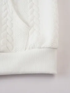 Detail view of the white jacquard knit texture on a men's warm zip hooded sweatshirt