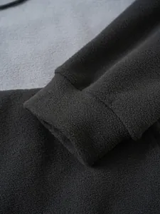 Close-up of the elastic cuff on a warm polar fleece color block hoodie for men