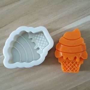 Close-up detail view of ice cream cone silicone mold with orange finished product