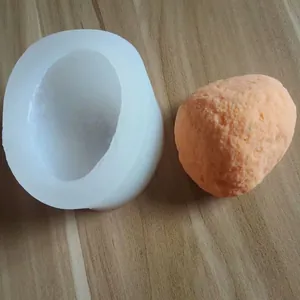 Detailed shot of a 3D stone-shaped silicone mold with a textured plaster stone sample