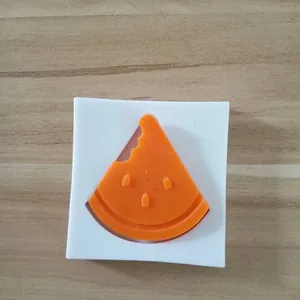 Detailed close-up of a watermelon-shaped silicone mold for creative cake decoration.