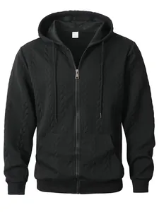 Macro view of black men's zip-up hoodie featuring a unique textured jacquard pattern