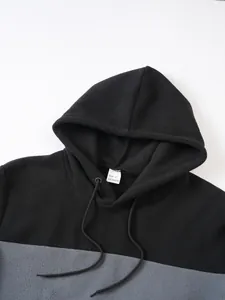 Close-up of men's color-block polar fleece hoodie showing hood and size S tag