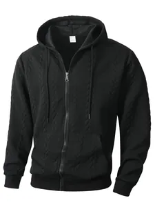 Detailed view of a premium men's black zip-up hoodie featuring an intricate jacquard texture