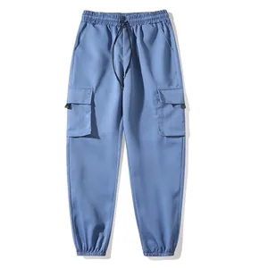 Front view of blue cargo joggers featuring elastic waistband and side flap pockets