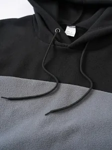 Close-up of color-block fleece hoodie texture and collar detail