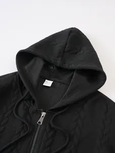 Detail of black jacquard zip-up hoodie with texture and neckline size label