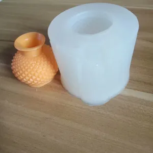 Detailed view of DIY 3D vase silicone mold with an orange textured resin vase finish