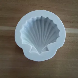 Top view detail of a shell-shaped white silicone mold for DIY baking and chocolate.
