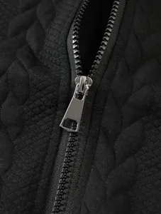 Close-up of durable metal zipper on men's premium black jacquard textured sweatshirt