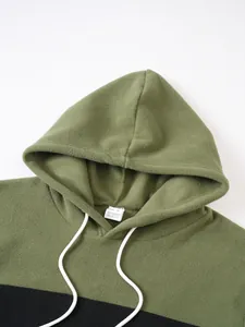 Close-up of olive green fleece hoodie showing hood detail and drawstrings