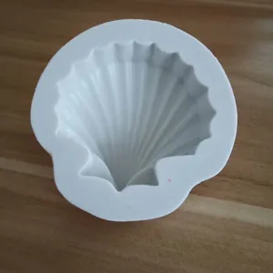 Close-up of white seashell-shaped silicone mold for DIY baking and chocolate making