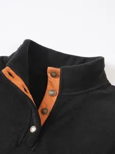 Detailed view of the button placket and soft fleece material on a men's stand collar sweatshirt