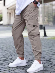 Men's khaki cargo joggers featuring elastic drawstring waist and large side pockets
