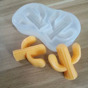 Detail of a 2-cavity cactus silicone mold showing the finished orange decorative items