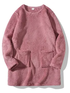 Close-up detail of soft pink fuzzy fleece sweatshirt with pockets and round neck