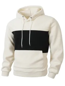 Macro view of soft polar fleece texture on cream and black color-block men's hoodie