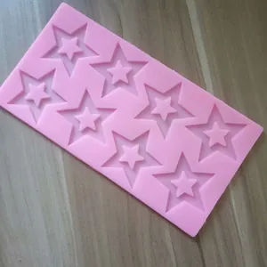 Detail view of 8-cavity star-shaped pink silicone mold for DIY baking and chocolate.