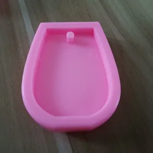Macro detail of a pink wine glass shape silicone mold for DIY keychains and resin crafts