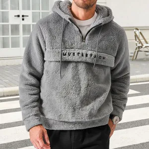 Men's grey sherpa fleece hoodie with half-zip and drawstring in urban street style