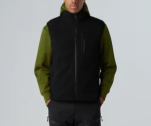 Close-up detail of a men's black fleece outdoor vest featuring a vertical zip pocket