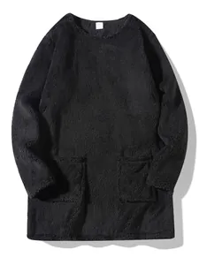 Macro view of black long sleeve oversized plush fleece sweatshirt with two front pockets