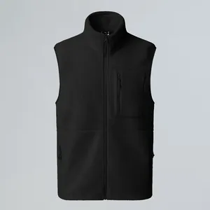 Detail view of a black outdoor fleece vest with a stand collar and zippered chest pocket