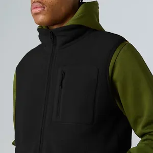 Detail view of a men's black outdoor fleece vest featuring a vertical zippered chest pocket.