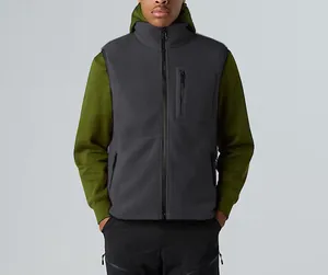 Close-up of a men's dark grey fleece vest with stand collar and zipper pockets.