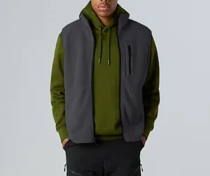 Close-up detail of a grey fleece outdoor vest with a stand collar and chest pocket