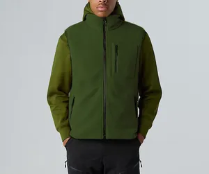 Close-up of men's green fleece vest featuring a chest zipper pocket and stand collar detail