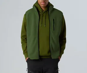 Detailed view of a mens olive green fleece vest styled with a matching hoodie for outdoor activities