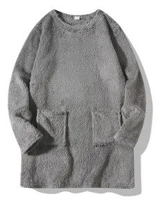 Detailed view of a grey plush fleece crewneck sweatshirt with two functional front pockets
