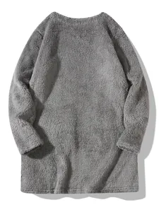 Macro view of grey plush fleece fabric and front pockets on oversized sweatshirt