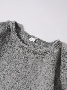 Detailed macro view of grey fleece sweatshirt collar showing soft textured plush fabric